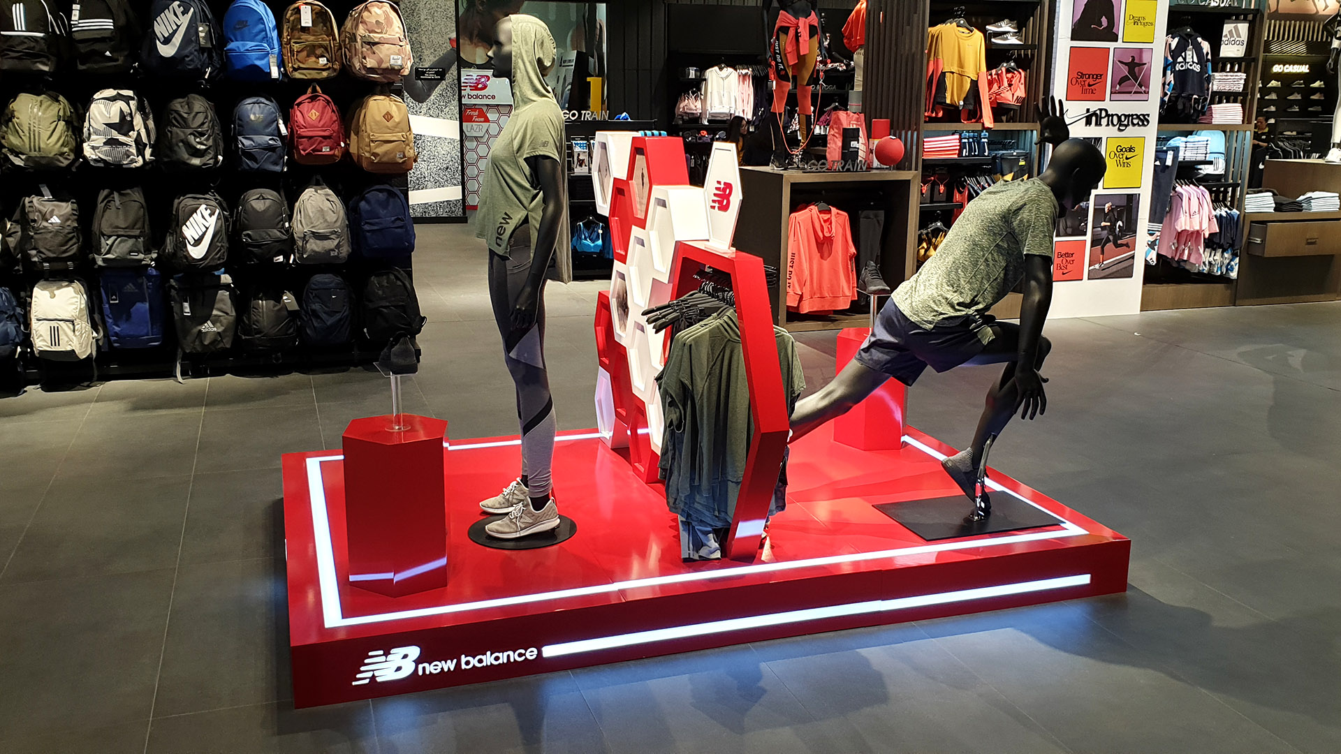 New Balance retail display stand fabricated and installed by ME Visual at Go Sport stores across Qatar.