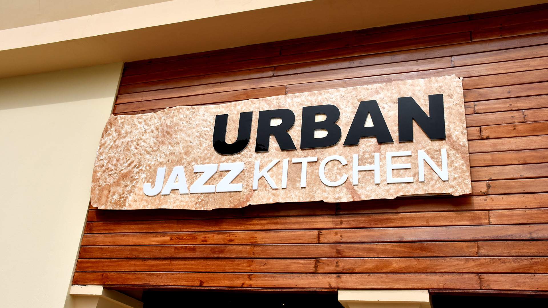 LED Lit Push Through shopfront signs for Urban Jazz Kitchen on The Pearl, fabricated and installed by ME Visual, Qatar